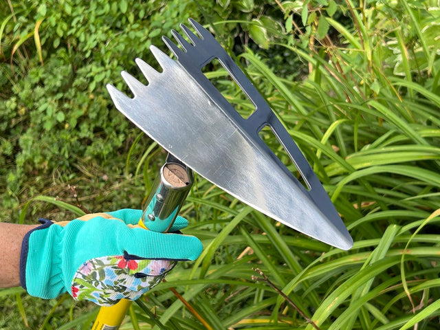 Spear Head Hoe held in a gardener's gloved hand, showing the stainless blade