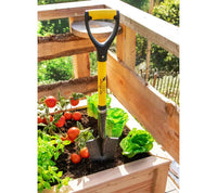 Spear Head Spade SHMini mini shovel in a raised bed of tomatoes and lettuce