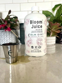 Bloom Juice 32 oz bottle with a measuring cup