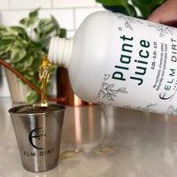 Pouring Plant Juice concentrate into a measuring cup