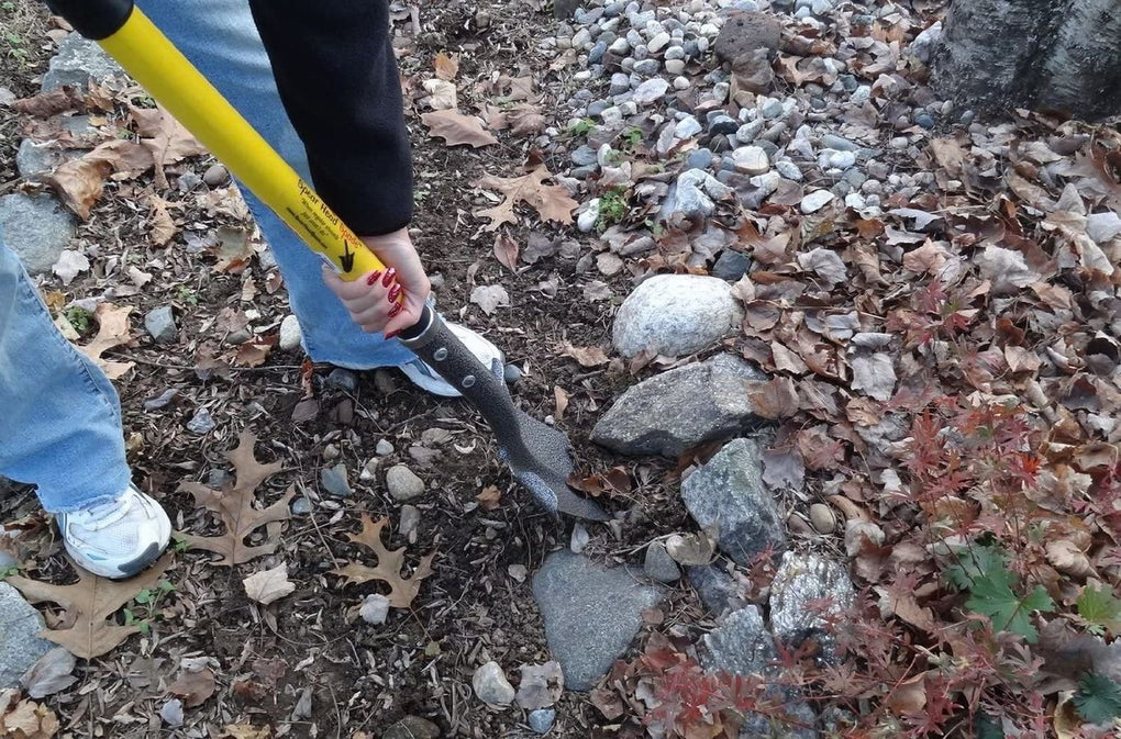 Cutting through roots while digging with a garden spade