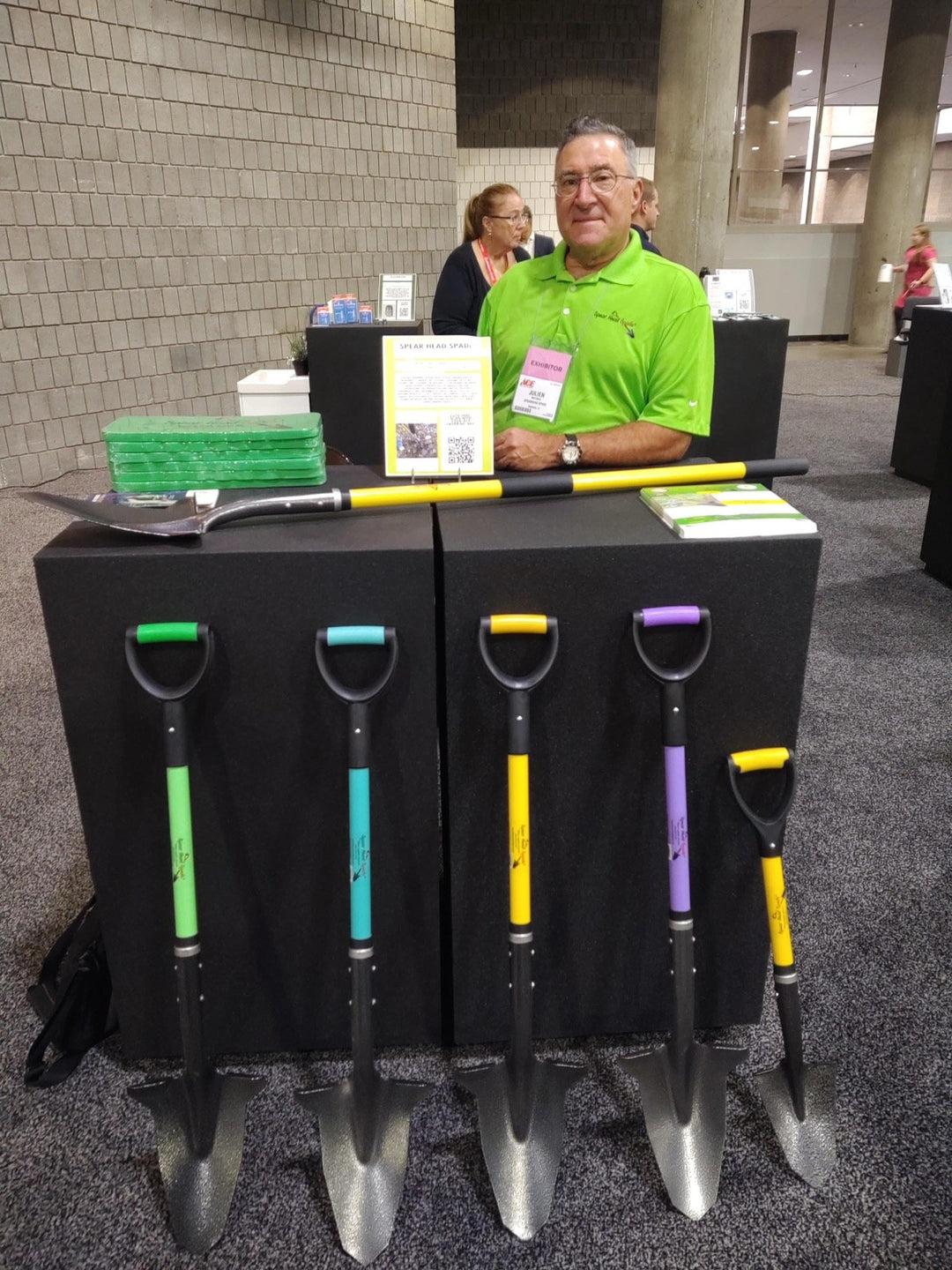 Julien Mathieu at the Ace Hardware show in 2019, behind a display of Spear Head Spades